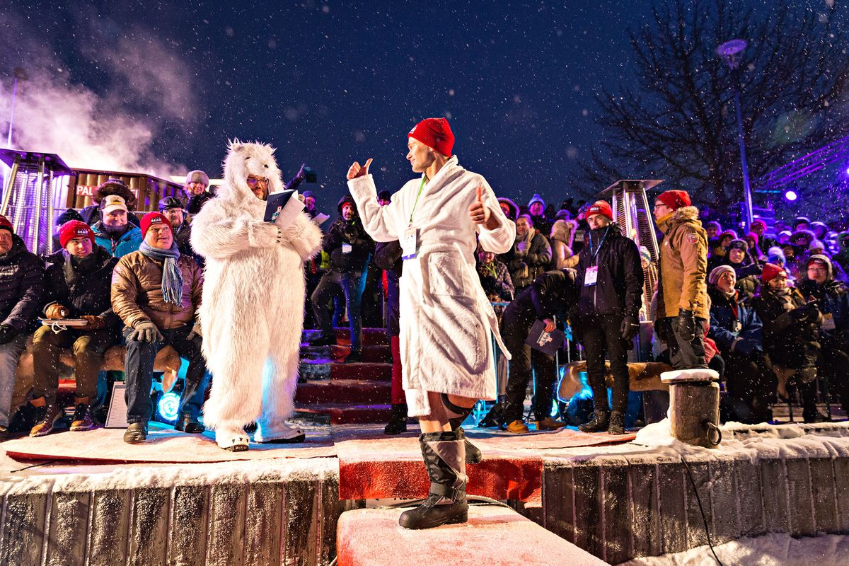 Finnish Minister of the Interior Kai Mykkänen walks the red carpet in insulated boots to take the plunge at Polar Bear Pitching.