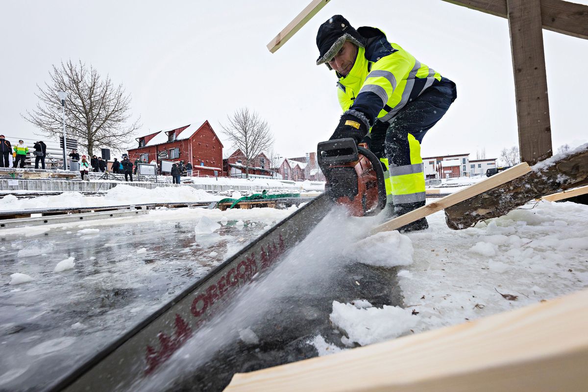The ice hole was created by sawing through multiple feet of ice atop the frozen Baltic Sea.